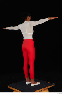 Adelle Sabelle casual dressed red leggings standing t poses white…